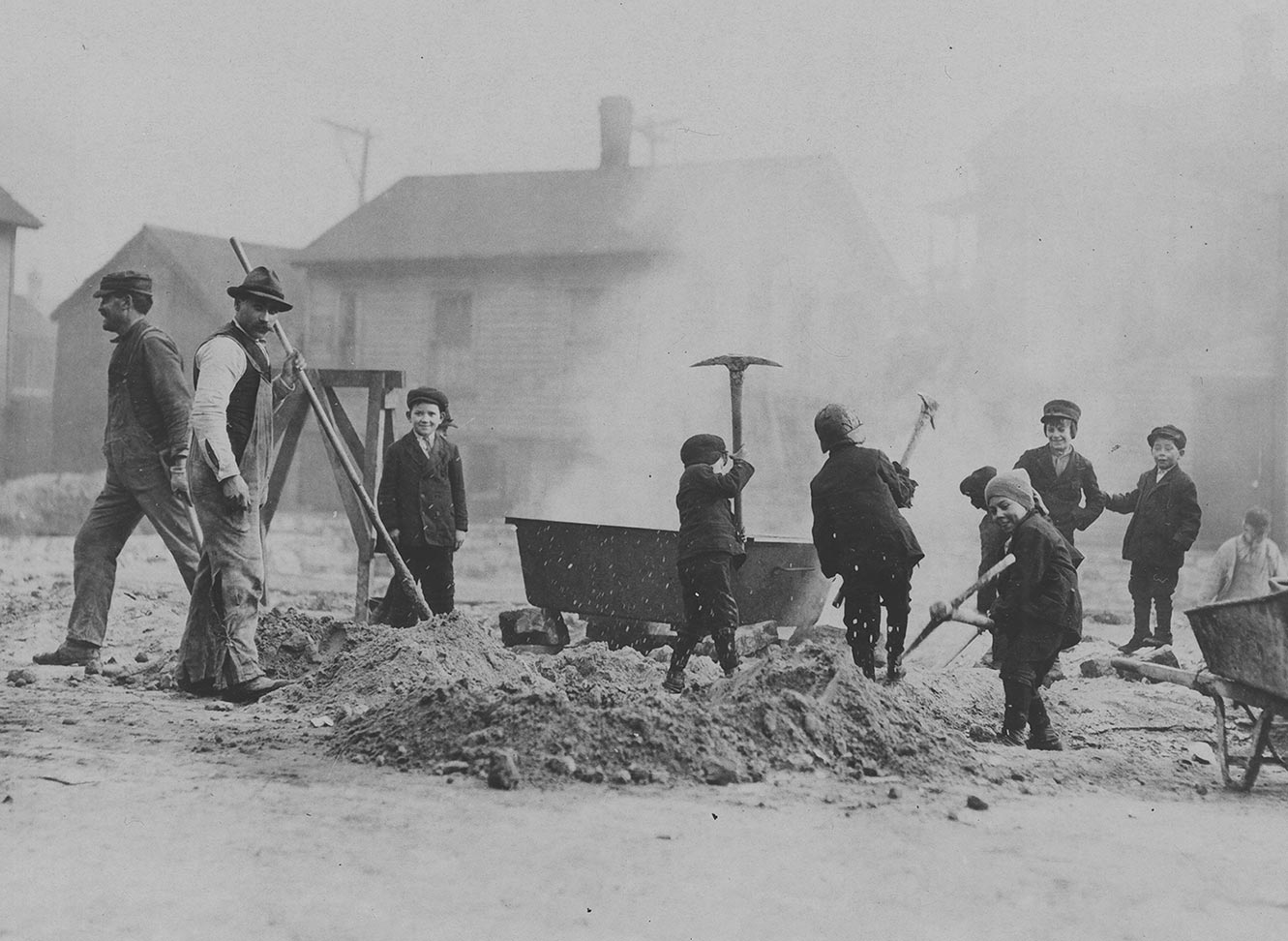 Children digging with pick axes on a Chicago street; Chicago, IL. Source: ICHi-52108. Chicago History Museum. Reproduction of photographic print, photographer unknown.